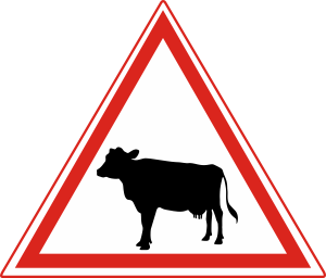 Which of the following indicates "Road Crossing for Cattle Ahead"?